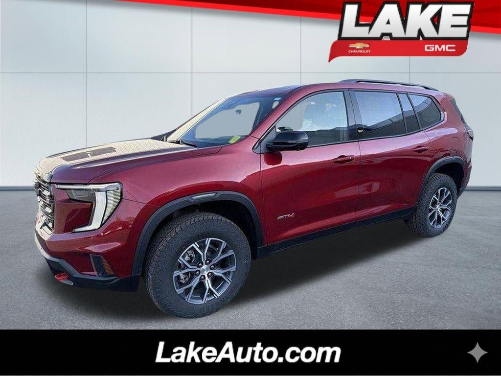 2026 GMC Acadia AT4 in Volcanic Red Tintcoat — front three-quarter view