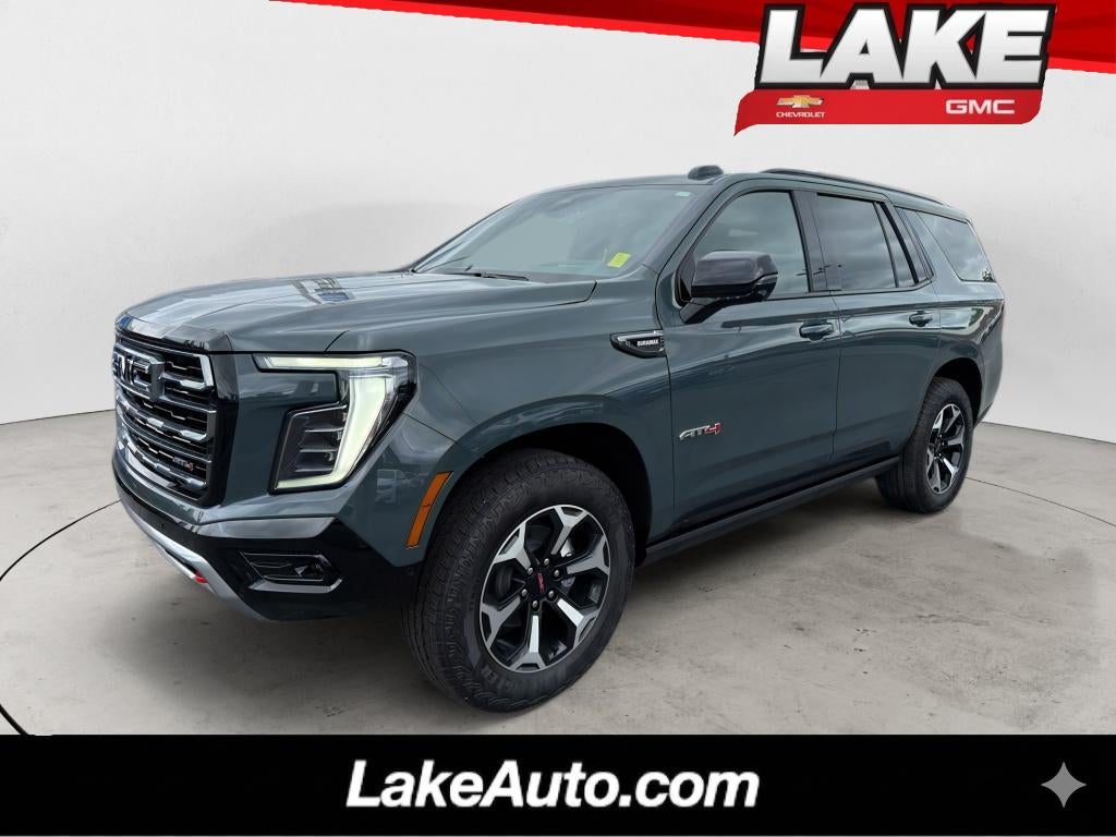 2026 GMC Yukon AT4 in Midnight Pine — front three-quarter view