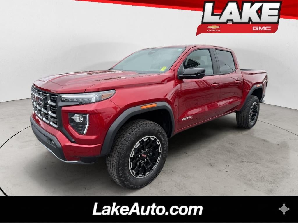 2026 GMC Canyon AT4 in Volcanic Red Tintcoat — front three-quarter view